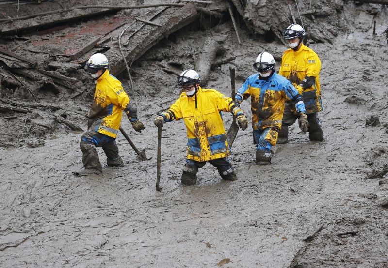 Rescuers conduct a search operation at the site of a mudslide at Izusan in Atami, Shizuoka prefecture, southwest of Tokyo on July 4, 2021. More than 1,000 soldiers, firefighters and police on Sunday waded through a giant mudslide that ripped through the resort town as it swept away houses and cars. (AP/PTI Photo)