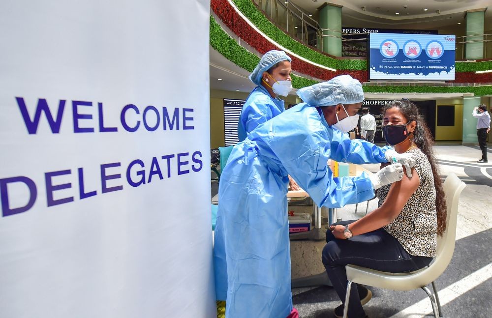 Bengaluru: A medic administers a dose of a Covid-19 vaccine to a visitor at a mall during COVID-induced lockdown in Bengaluru, Monday, July 5, 2021. (PTI Photo/Shailendra Bhojak)