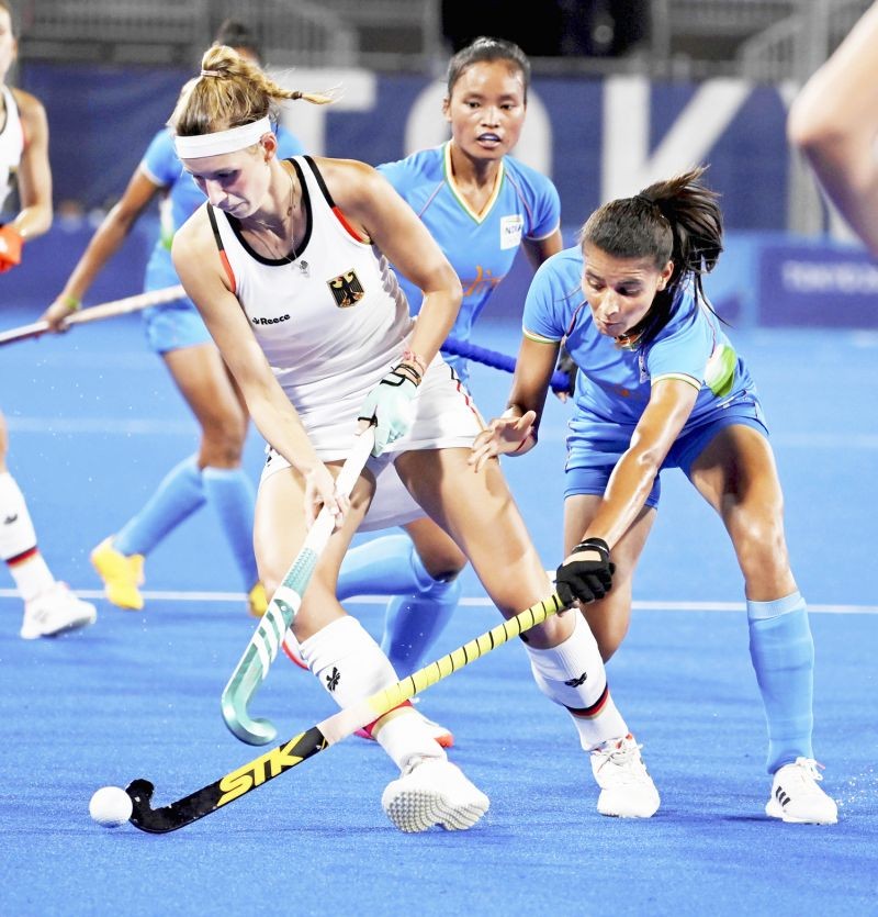 Tokyo:India's Sharmila Devi tries to take possession of the ball from Hanna Carina Granitzki (L) during Germany vs India Pool A Hockey match at the Summer Olympics 2020, in Tokyo, Monday, July 26, 2021. (PTI Photo/Gurinder Osan)