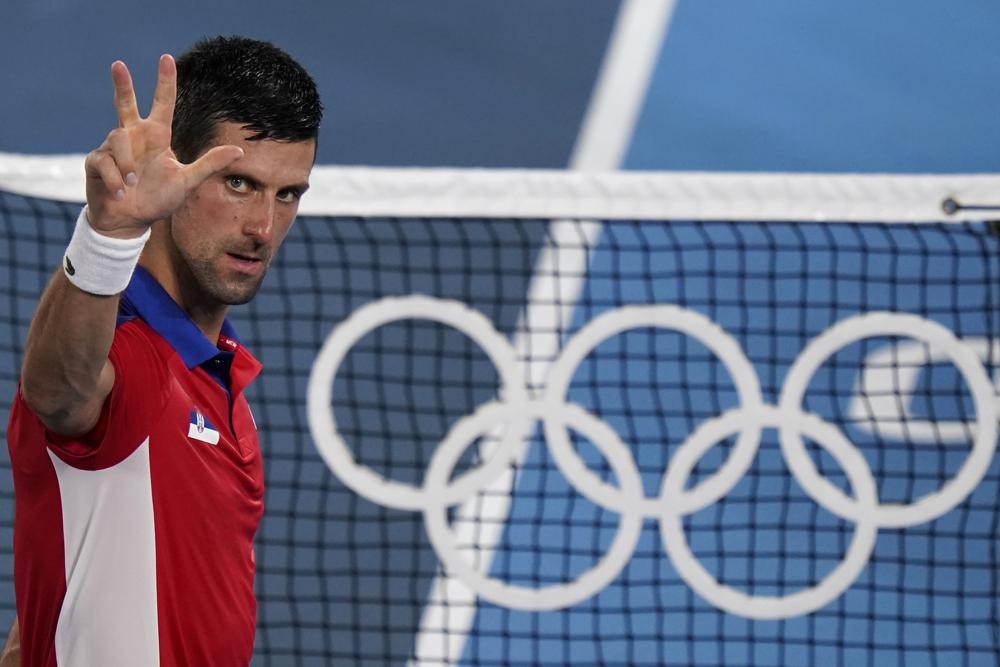 Novak Djokovic, of Serbia, celebrates after defeating Kei Nishikori, of Japan, during the quarterfinals of the tennis competition at the 2020 Summer Olympics, Thursday, July 29, 2021, in Tokyo, Japan. (AP Photo/Seth Wenig)