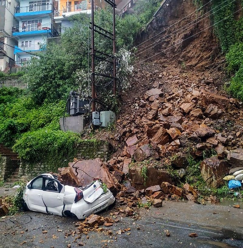 A car buried under the debris after a landslide due to heavy rainfall, at Vikasnagar in Shimla on July 28, 2021. (PTI Photo)