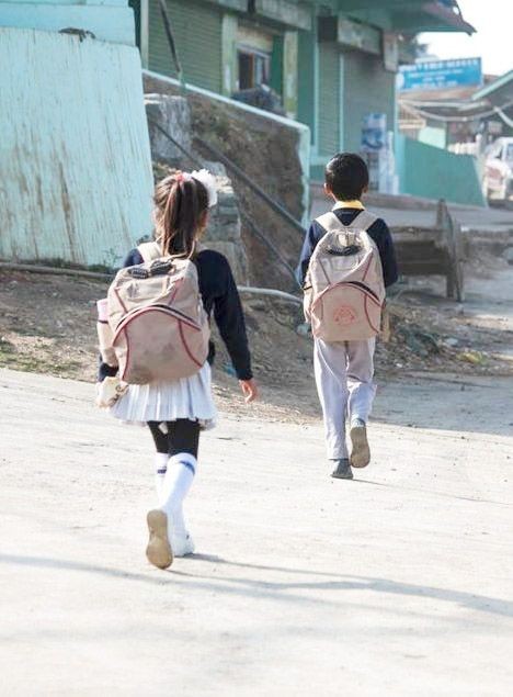 Children on their way to school at Kiphire town before the  COVID-19 pandemic. (File Photo)