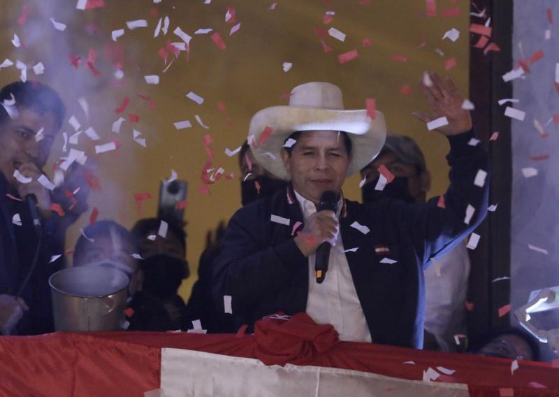 Pedro Castillo waves to supporters after election authorities declared him president-elect during celebrations at his party's campaign headquarters in Lima, Peru, Monday, July 19, 2021. Castillo was declared president more than a month after elections took place and after opponent Keiko Fujimori claimed that the election was tainted by fraud. (AP Photo)