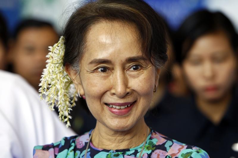 FILE - In this Dec. 14, 2018, file photo, ousted Myanmar leader Aung San Suu Kyi arrives to attend the Myanmar Entrepreneurship Summit at the Myanmar International Convention Center in Naypyidaw, Myanmar. Lawyers for Suu Kyi said Monday, July 12, 2021 they have been informed by the military-installed government that four new charges of corruption have been filed against her. The military overthrew Suu Kyi’s elected government in February and arrested her and top members of her National League for Democracy party, including President Win Myint. (AP Photo/Aung Shine Oo, File)