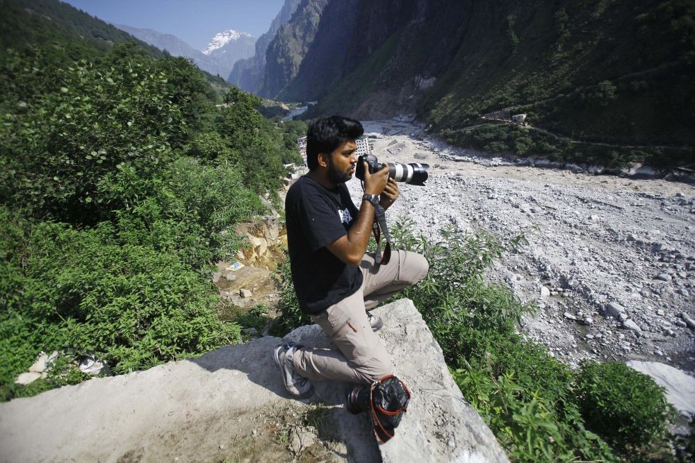 Govindghat: Reuters photographer Danish Siddiqui covers the monsoon floods and landslides in the upper reaches of Govindghat, India, Saturday, June 22, 2013. Afghan government forces battled Friday to retake a border crossing with Pakistan from Taliban insurgents, and the Reuters news agency said one of its photographers was killed in the area. Reuters said Pulitzer Prize-winning photographer Siddiqui, who was embedded with the Afghan special forces, was killed Friday, July 16, 2021, as the commando unit sought to recapture Spin Boldak.AP/PTI Photo
