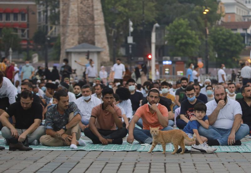 Muslims offer prayers during the first day of Eid al-Adha, outside the iconic Haghia Sophia in the historic Sultan Ahmed district of Istanbul on July 20, 2021. Thousands of Muslims attended dawn Eid al-Adha prayers in Istanbul. (AP/PTI)