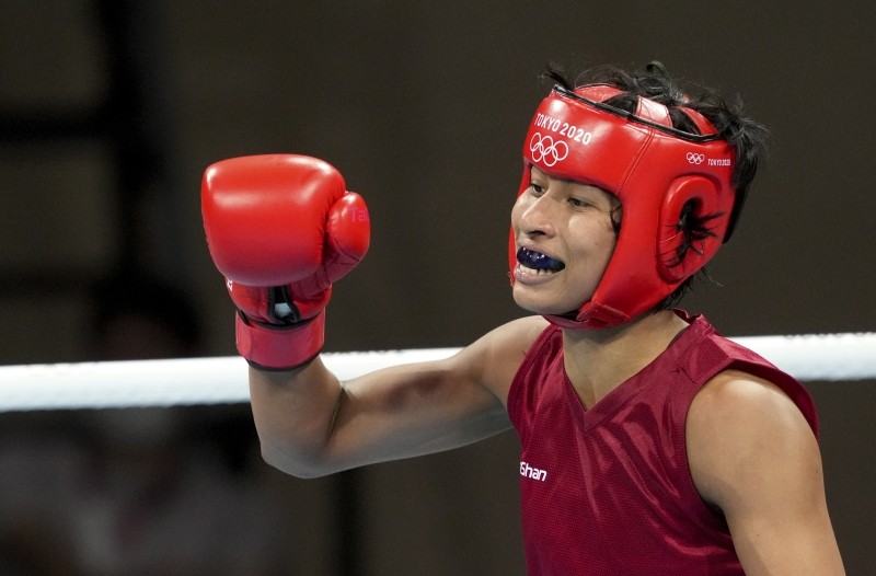 Tokyo: India's Lovlina Borgohain clenches her fist after winning her bout against Chen Nien-Chin of Chinese Taipei during women's welterweight (64-69kg) category boxing match, at the Summer Olympics 2020 in Tokyo, Friday, July 30, 2021. Borgohain won 4-1. (PTI Photo/Gurinder Osan)