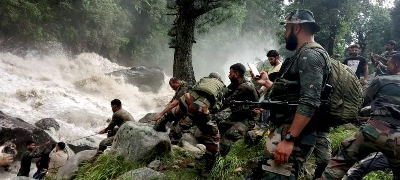 Army personnel during a rescue operation after flash floods due to a cloudburst at Hanzor in Kishtwar district. 8 dead bodies recovered & 12 injured rescued till now. (PTI Photo)