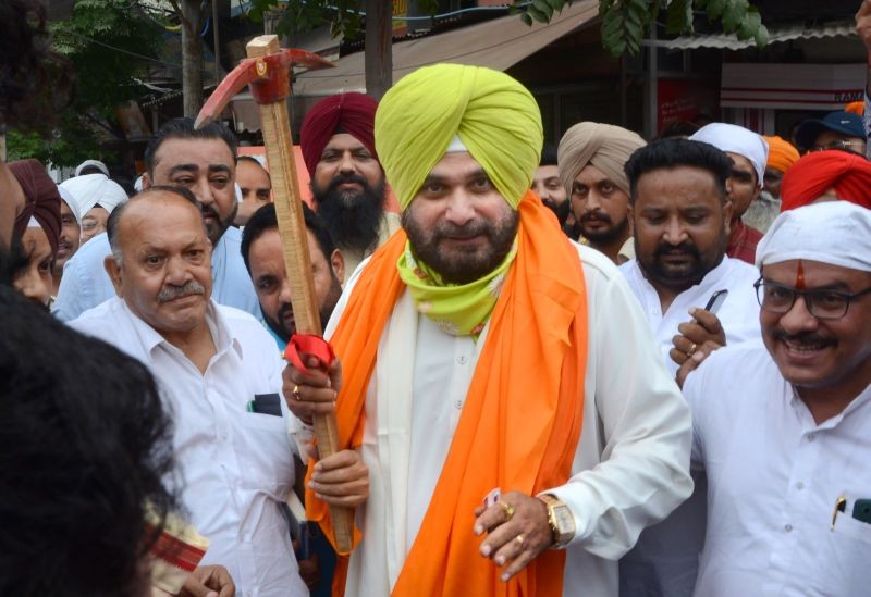 Punjab Congress President Navjot Singh Sidhu during his visit to inaugurate the construction and beautification work of Ram Mandir gate at 100ft. road in Amritsar on August 30. (PTI Photo)