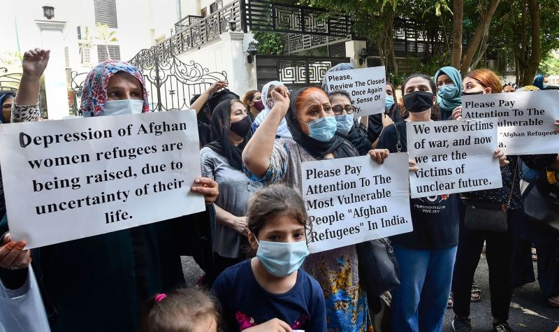 Afghan refugees protest in front of the office of the United Nations High Commissioner for Refugees demanding refugee status/cards for all Afghans, resettlement option to a third country, and security from UNHCR and the Indian government, in New Delhi on August 23, 2021. (PTI Photo)