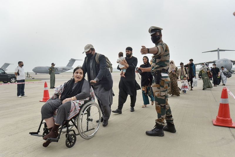 People who were stranded in crisis-hit Afghanistan arrive by a special repatriation flight of IAF at the Hindan Air Force Station, in Ghaziabad on August 22, 2021. (PTI Photo)