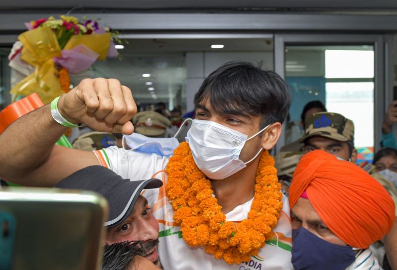 New Delhi: Olympic gold medalist Neeraj Chopra being welcomed on his arrival at IGI Airport, after the end of the Tokyo Summer Olympics 2020, in New Delhi, Monday, Aug. 9, 2021. (PTI Photo/Gurinder Osan)