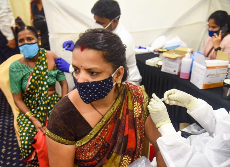 Beneficiaries receive COVID-19 vaccine dose during a vaccination camp at Vile Parle East in Mumbai on August 18, 2021. (PTI Photo)