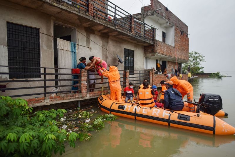 National Disaster Response Force team evacuates people from a flood-affected area at Salori in Prayagraj on August 11, 2021. (PTI Photo)