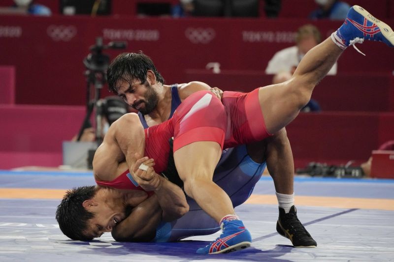 Tokyo: India's Bajrang Bajrang, top, competes against Kazakhstan's Daulet Niyazbekov during their men's freestyle 65kg wrestling bronze medal match at the 2020 Summer Olympics, Saturday, Aug. 7, 2021, in Chiba, Japan.AP/PTI