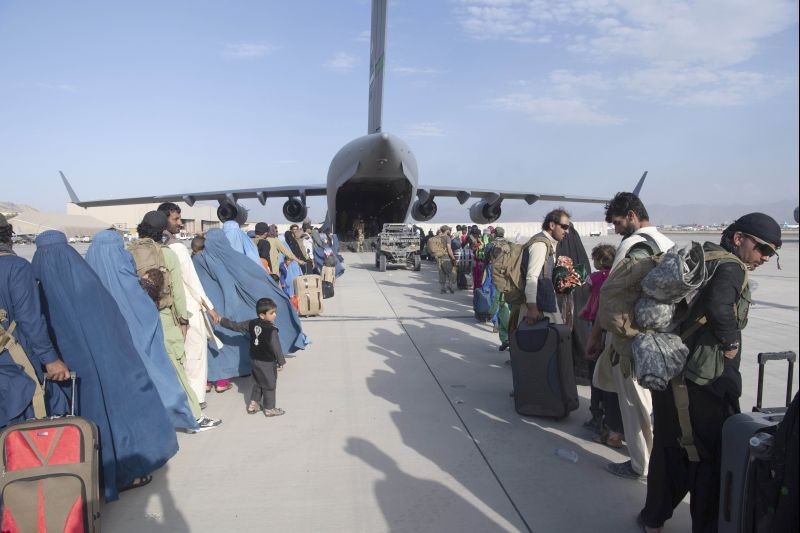 In this image provided by the U.S. Air Force, U.S. Air Force loadmasters and pilots assigned to the 816th Expeditionary Airlift Squadron, load people being evacuated from Afghanistan onto a U.S. Air Force C-17 Globemaster III at Hamid Karzai International Airport in Kabul, Afghanistan on August 24, 2021. (AP/PTI Photo)