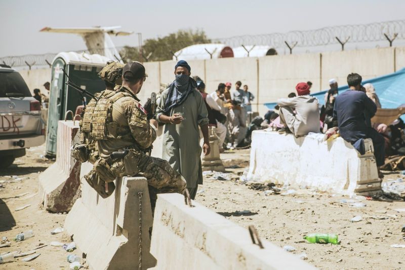 In this photo provided by the U.S. Marine Corps, Canadian coalition forces assist during an evacuation at Hamid Karzai International Airport in Kabul, Afghanistan on August 24, 2021. (AP/PTI Photo)