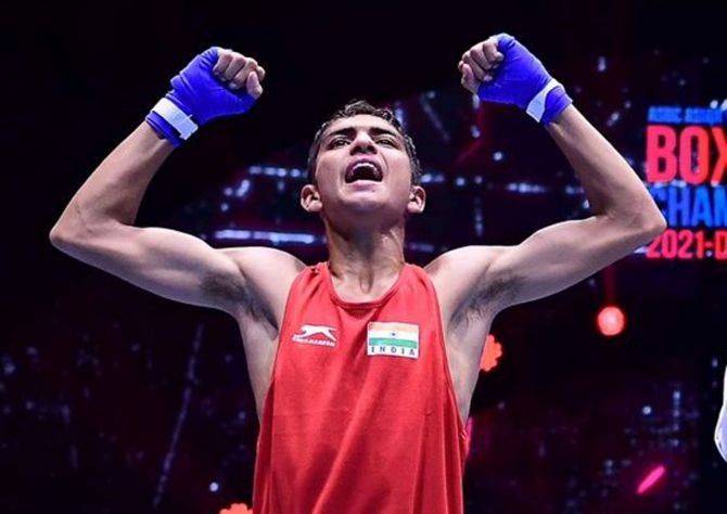 Rohit Chamoli celebrates after winning gold in the junior boys' 48kg final at the Asian Junior Boxing Championships in Dubai on Sunday. Photograph: Boxing Federation of India