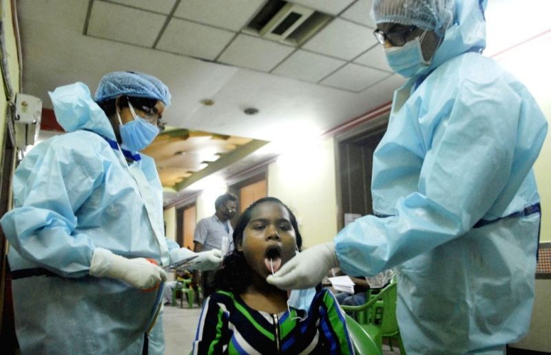 Health Worker collected swab from children for Covid test. (IANS File Photo)