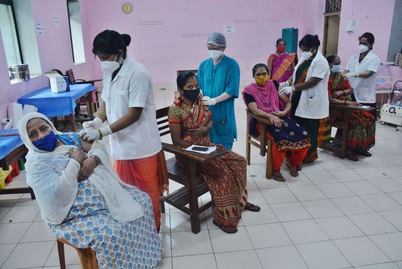 Health workers administer a dose of Covid-19 vaccine to women during a special vaccination camp at district Nursing Training Vaccination Center on the occasion of Raksha Bandhan, in Thane on August 22. (PTI Photo )