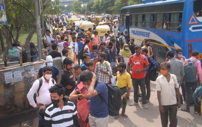 People crowd at a bus stand. (PTI File Photo)