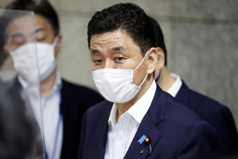 Japan's Defense Minister Nobuo Kishi speaks to reporters at Defense Ministry in Tokyo Monday, Aug. 23, 2021. Japan will send three military aircraft to Afghanistan starting Monday to evacuate Japanese citizens and local staff as security deteriorates following the Taliban takeover, officials said. (Kyodo News via AP)