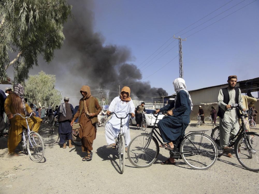 Smoke rises after fighting between the Taliban and Afghan security personnel, in Kandahar, southwest of Kabul, Afghanistan on August 12. (AP Photo)