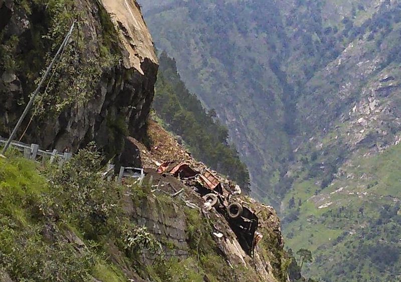 Many people feared to trap after a landslide occurred on the Reckong Peo-Shimla Highway in Kinnaur district on August 11, 2021. One truck and an HRTC bus reported came under the rubble. Indo-Tibetan Border Police (ITBP) teams rushed for rescue. (PTI Photo)