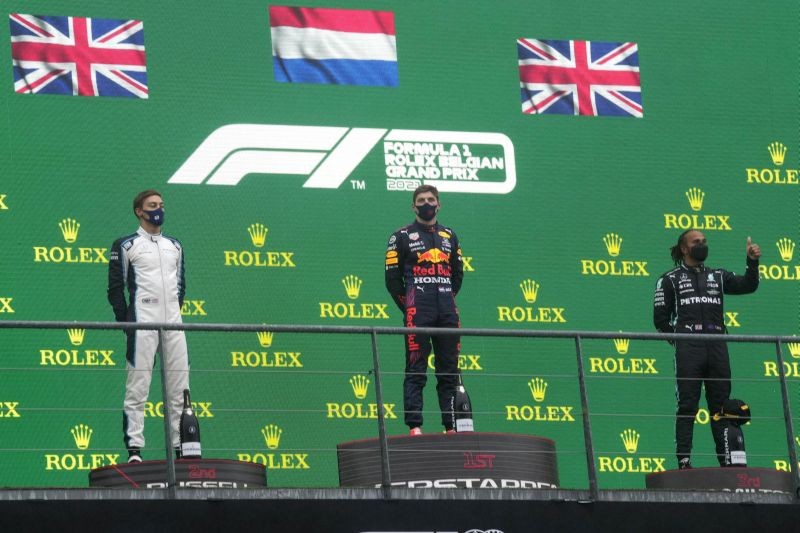 Spa: First place Red Bull driver Max Verstappen of the Netherlands, center, second place Williams driver George Russell of Britain, left, and third place Mercedes driver Lewis Hamilton of Britain, right, stand on the podium after the Formula One Grand Prix at the Spa-Francorchamps racetrack in Spa, Belgium, Sunday, Aug. 29, 2021. The race was red flagged due to weather conditions.AP/PTI(