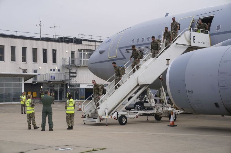 Members of the British armed forces 16 Air Assault Brigade disembark a flight from Afghanistan at RAF Brize Norton, in Oxfordshire, England on August 29, 2021. Military planes carrying British troops and diplomats from Kabul landed at a U.K. air base after the U.K's two-week evacuation operation ended. The U.K. ambassador to Afghanistan, Laurie Bristow, was among those who arrived Sunday at RAF Brize Norton northwest of London, hours after the government announced that all British personnel had left Kabul. (AP/PTI Photo)