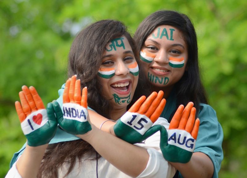 Amritsar: Women with their faces and hands painted in tricolours pose for photographs, ahead of Independence Day celebrations, in Amritsar, Friday, Aug. 13, 2021. (PTI Photo)