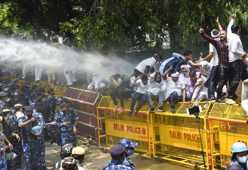 Police use water cannons to disperse Indian Youth Congress activists during "Parliament Gherao" protest over alleged rise in inflation, unemployment, three agricultural laws and snooping issue, in New Delhi on August 5, 2021. (PTI Photo)