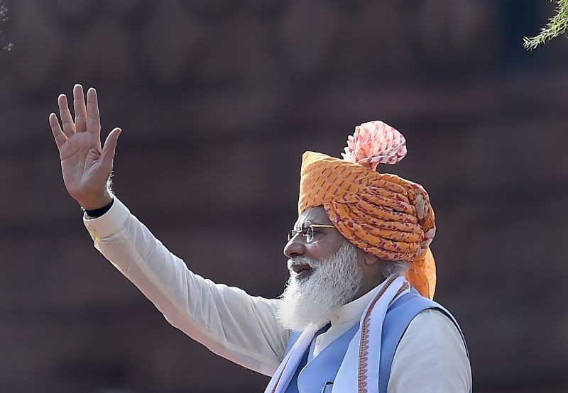 New Delhi: Prime Minister Narendra Modi waves at the audience during the 75th Independence Day function at the historic Red Fort, in New Delhi, Sunday, August 15, 2021. (PTI Photo/Kamal Singh)