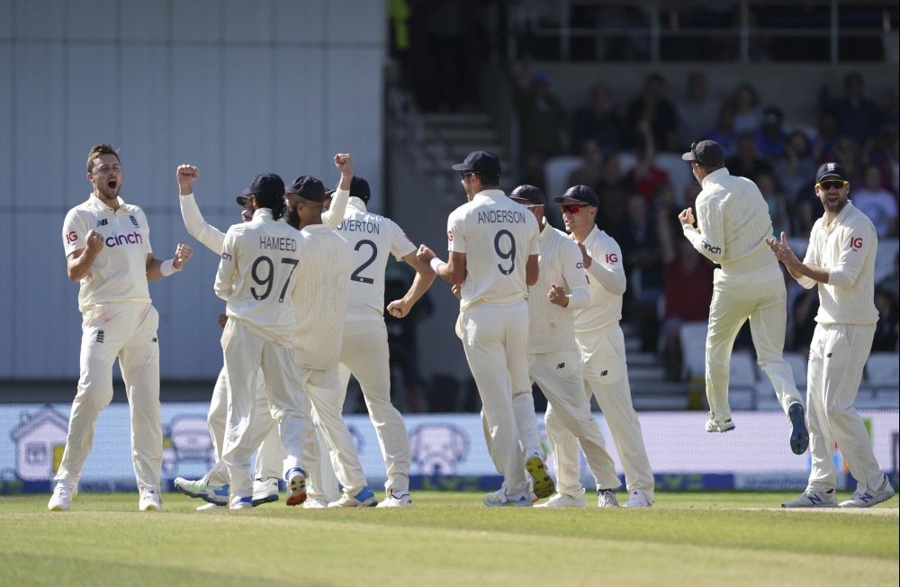 Leeds: England's Ollie Robinson , left, and teammates celebrate the dismissal of India's Cheteshwar Pujara during the fourth day of third test cricket match between England and India, at Headingley cricket ground in Leeds, England, Saturday, Aug. 28, 2021. AP/PTI