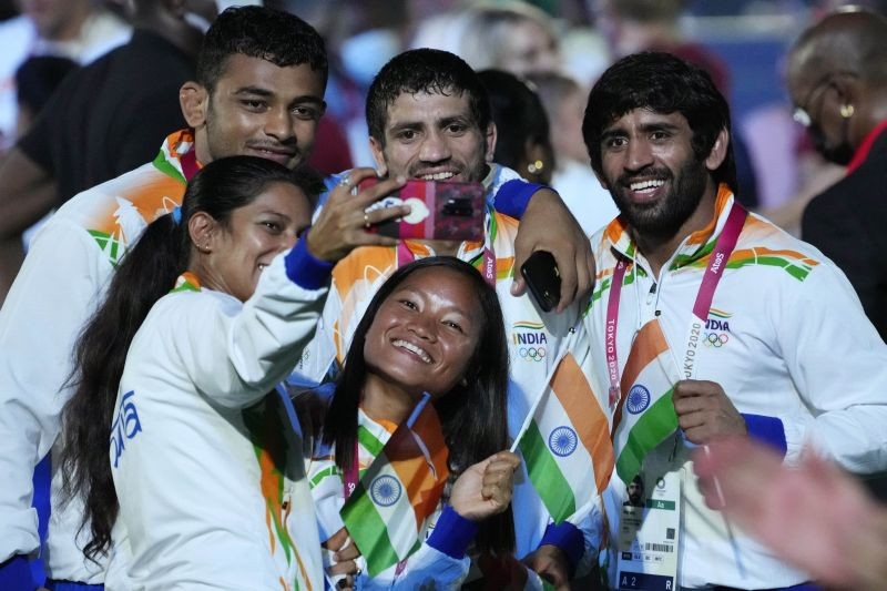 Tokyo: Athletes from India take a selfie during the closing ceremony in the Olympic Stadium at the 2020 Summer Olympics, Sunday, Aug. 8, 2021, in Tokyo, Japan. AP/PTI(