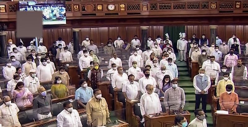 Parliamentarians in the Lok Sabha during the Monsoon Session of Parliament, in New Delhi on August 4, 2021. (LSTV/PTI Photo)