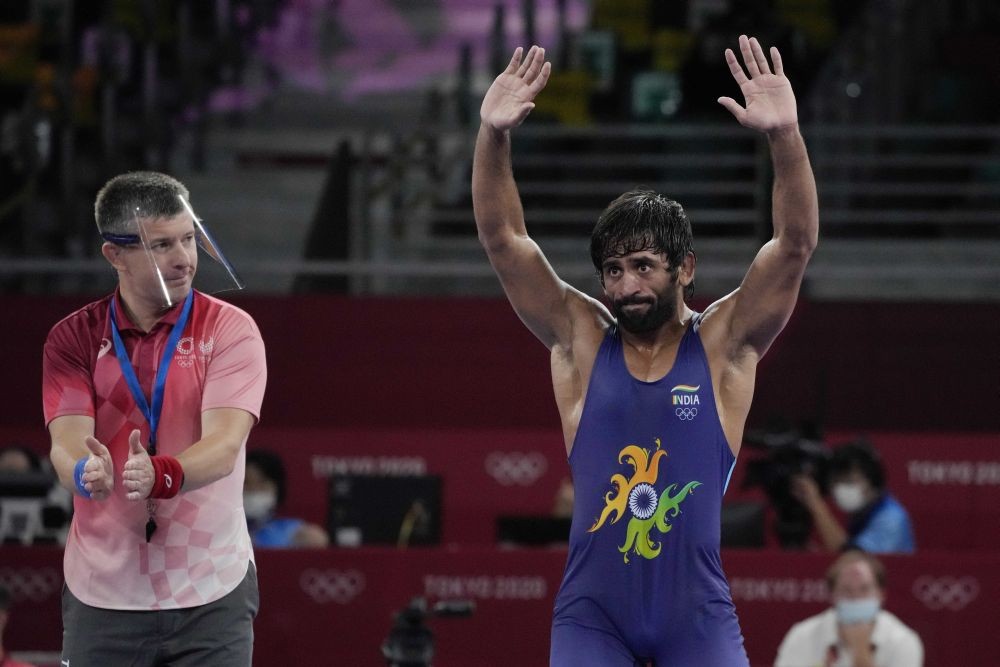 Tokyo: India's Bajrang Bajrang celebrates after defeating Kazakhstan's Daulet Niyazbekov during their men's freestyle 65kg wrestling bronze medal match at the 2020 Summer Olympics, Saturday, Aug. 7, 2021, in Chiba, Japan. AP/PTI(