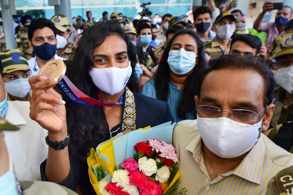 New Delhi: Bronze medalist in Tokyo Olympics 2020, Badminton player PV Sindhu arrives at Indira Gandhi International Airport in New Delhi, Tuesday, August 3, 2021. (PTI Photo/Kamal Kishore)