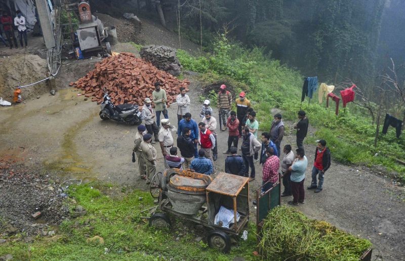 Forest department and police personnel carry out search operation after a 5-year-old girl was hunted by a leopard, in Kanlog, Shimla on August 6, 2021. (PTI Photo)