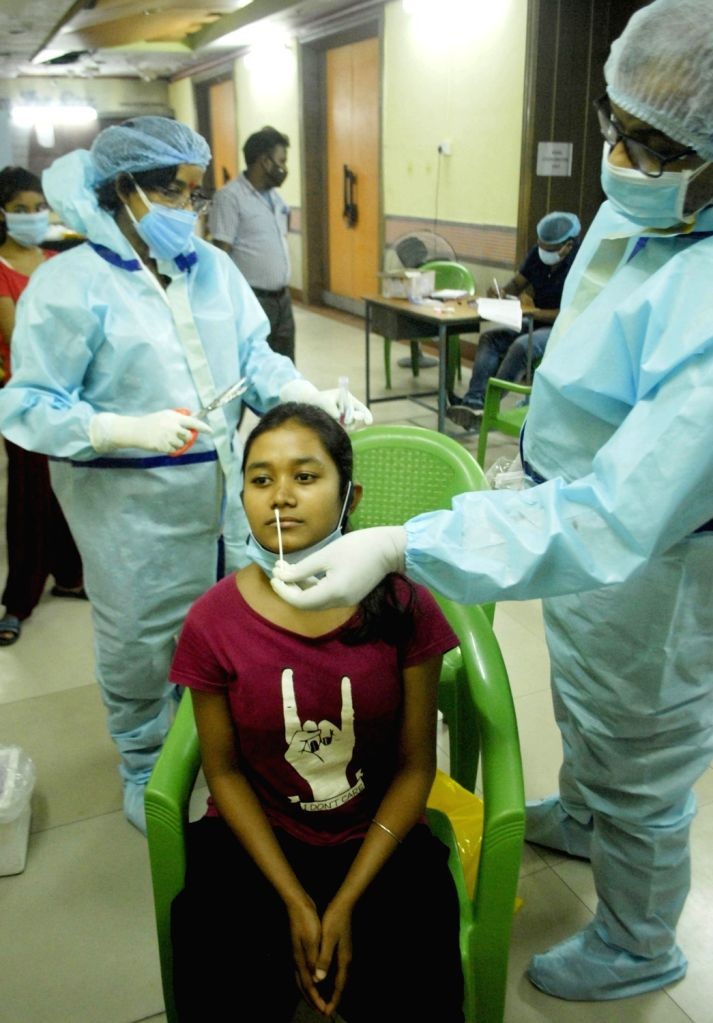 Health Worker collected swab from children for Covid test. (IANS File Photo)