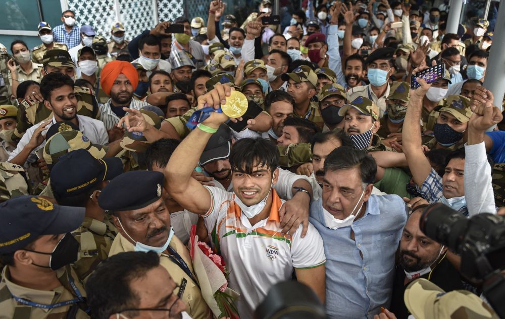 New Delhi: Olympic gold medalist Neeraj Chopra being welcomed on his arrival at IGI Airport, after the end of the Tokyo Summer Olympics 2020, in New Delhi, Monday, Aug. 9, 2021. (PTI Photo/Gurinder Osan)