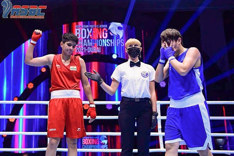 **EDS: IMAGE MADE AVAILABLE FROM BFI ON THURSDAY, AUG 26, 2021.** Dubai: Indian boxer Preeti (L) raises her hand after winning her semifinals match at ASBC Asian Youth & Junior Boxing Championships, in Dubai. (PTI Photo)
