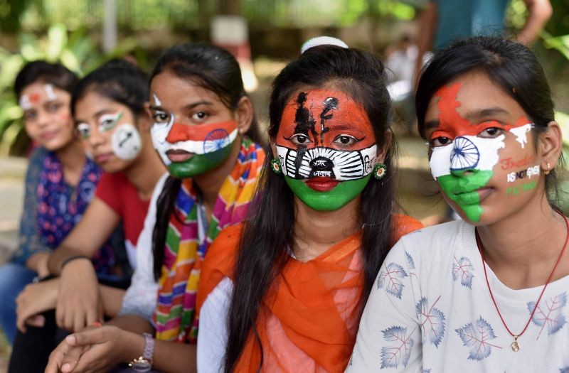 Prayagraj: Allahabad Central University students paint their faces with tricolour pose for photographs, on the eve of Independence Day celebrations at Chandra Shekhar Azad Park in Prayagraj, Saturday, Aug 14, 2021. (PTI Photo)