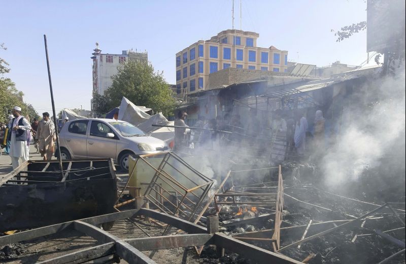 Smoke rises from damaged shops after fighting between Taliban and Afghan security forces in Kunduz city, northern Afghanistan on August 8, 2021. Taliban fighters Sunday took control of much of the capital of Kunduz province, including the governor's office and police headquarters, a provincial council member said. (AP/PTI Photo)