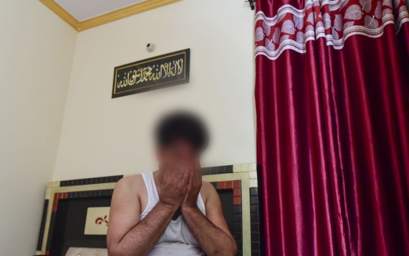 An Afghan security officer who fled Kabul last night, cries worrying about his family, in New Delhi on August 16, 2021. (PTI Photo)