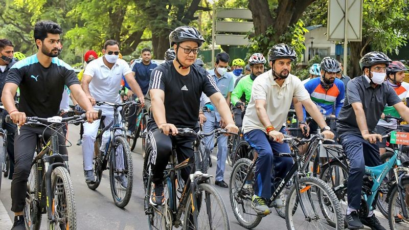 EDS: IMAGE POSTED BY @KirenRijiju New Delhi: Union Ministers Kiren Rijiju and Anurag Thakur take part in the 'Pedal For Health' initiative to promote cycling in daily lifestyle, in New Delhi, Saturday, Aug 14, 2021. (PTI Photo)
