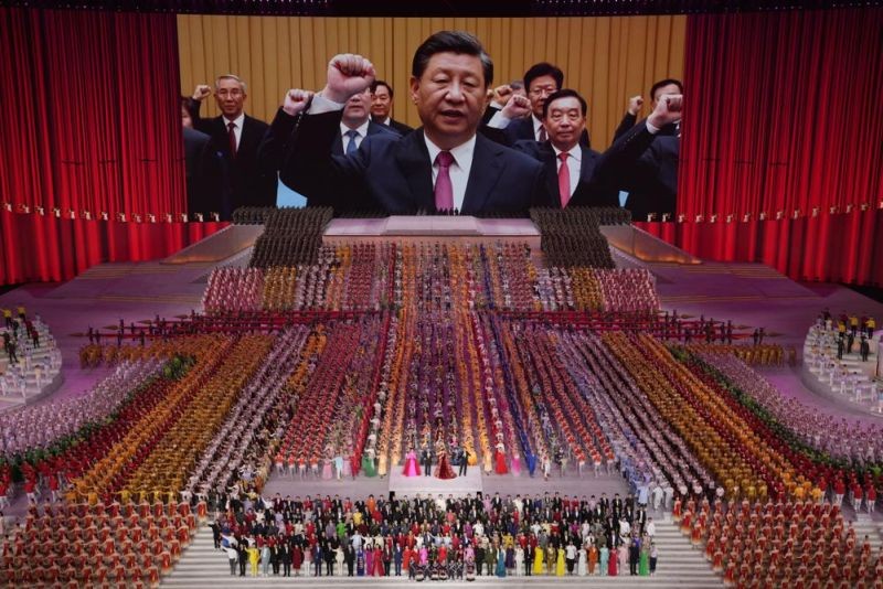 In this June 28, 2021, file photo, Chinese President Xi Jinping is seen leading other top officials pledging their vows to the party on screen during a gala show ahead of the 100th anniversary of the founding of the Chinese Communist Party in Beijing. An avalanche of changes launched by China's ruling Communist Party has jolted everyone from tech billionaires to school kids. Behind them: Xi's vision of reviving an idealized early era of vigorous party leadership, with more economic equality and tighter control over society and billionaire entrepreneurs. (AP File Photo)