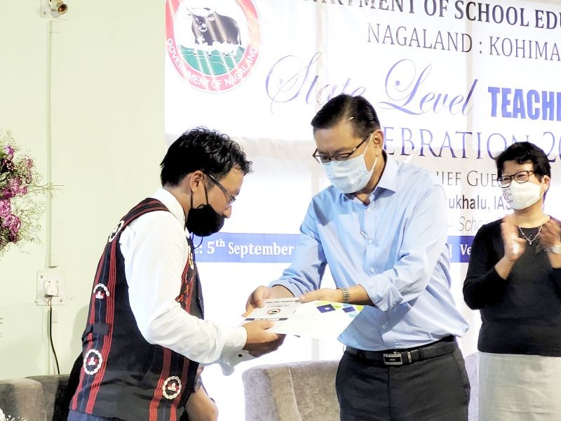 Advisor, School Education, KT Sukhalu handing over the Nagaland State Teachers’ Award in Kohima on September 5. (Morung Photo)