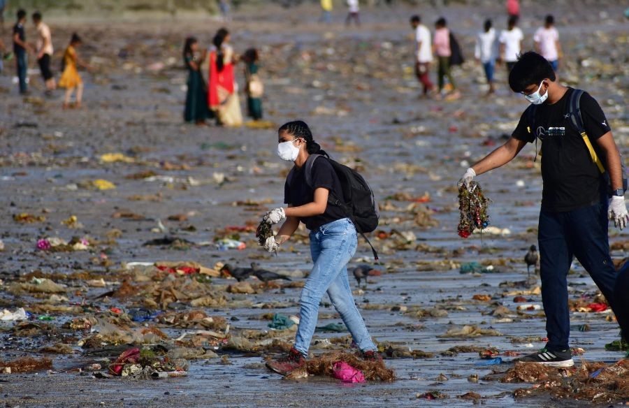 Mumbai: Volunteers participate in a beach clean-up drive a day after Ganesh immersion at Girgaon Chowpatty in Mumbai, Monday, 20 Sept. 20, 2021. (PTI Photo)