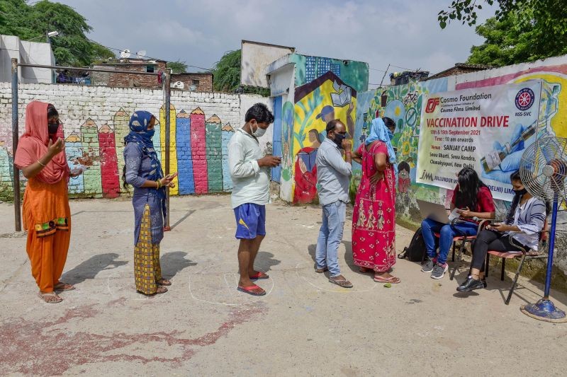 Beneficiaries wait to receive a dose of COVID-19 vaccine in New Delhi on September 18, 2021. (PTI Photo)